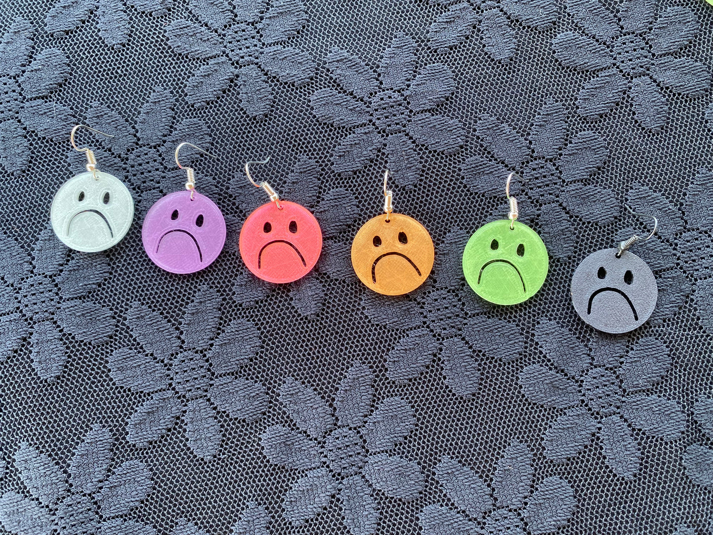 xs frownie earrings