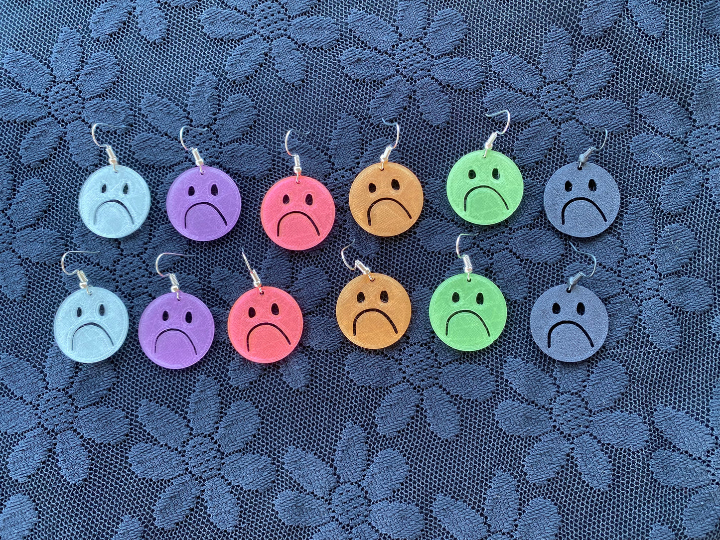 xs frownie earrings