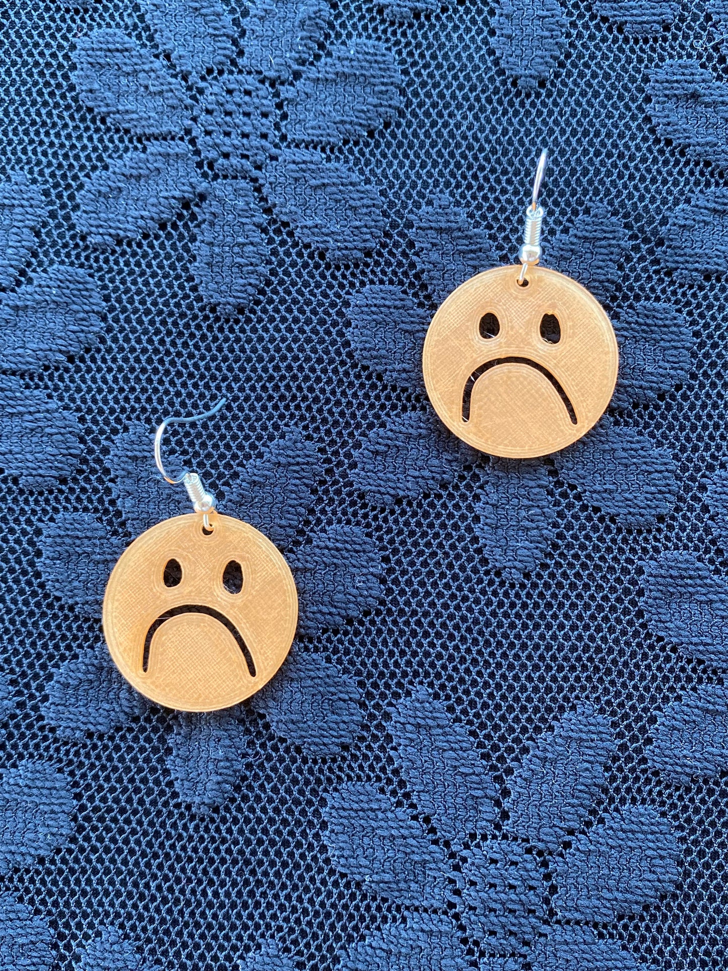 xs frownie earrings