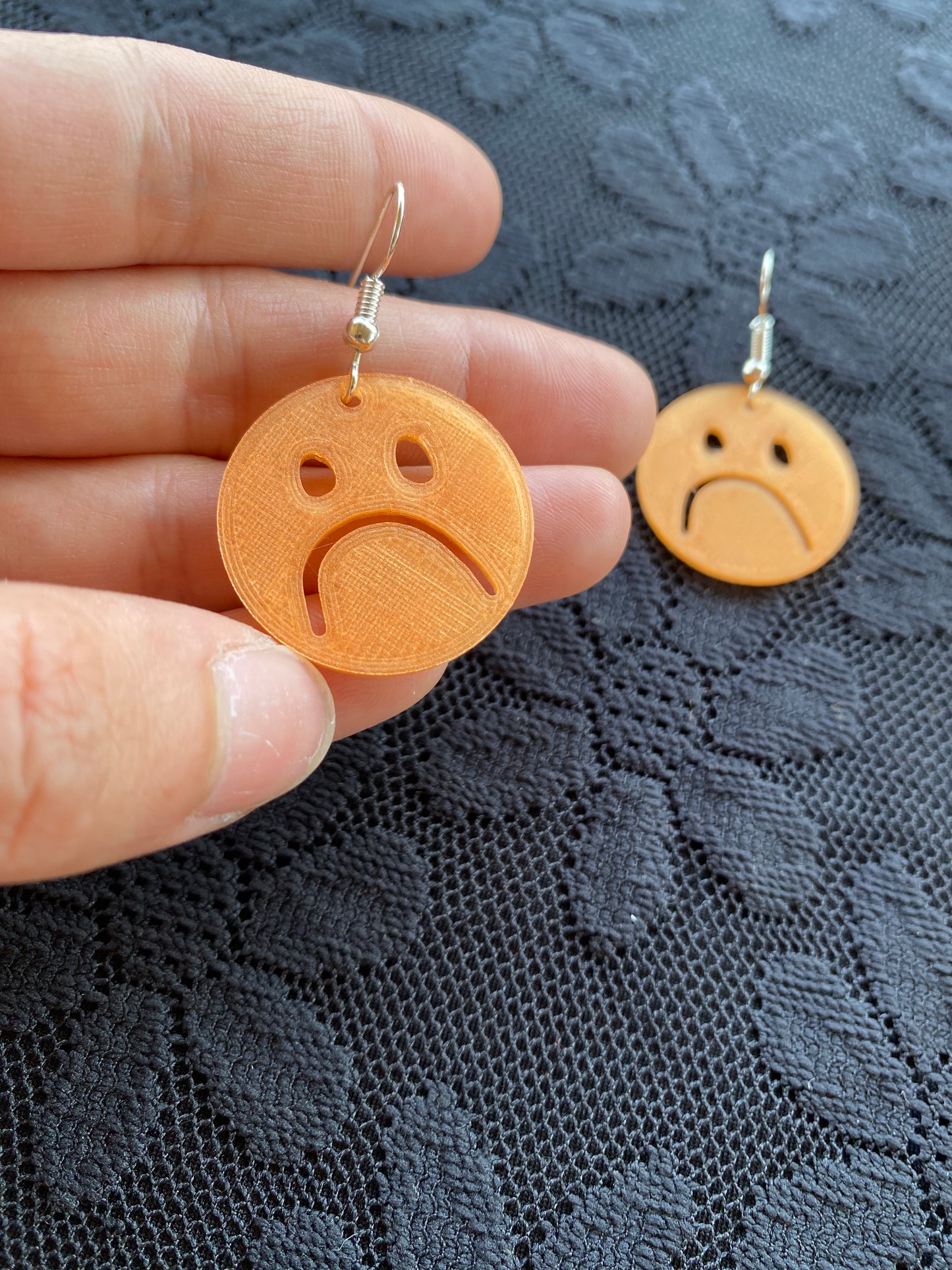 xs frownie earrings