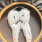 Embroidered tooth