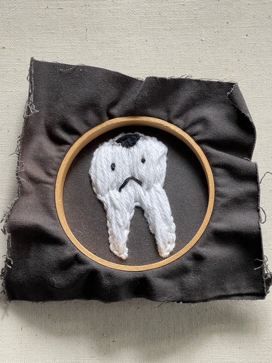 Embroidered tooth