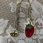 sad strawberry earrings