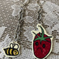 sad strawberry earrings