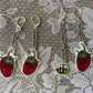 sad strawberry earrings